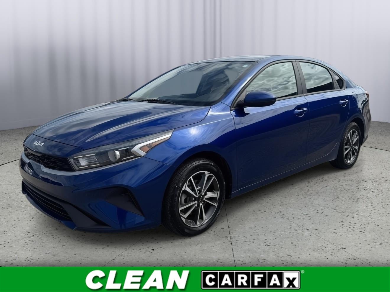 2024 Kia Forte LXS in Deep Sea Blue — front three-quarter view