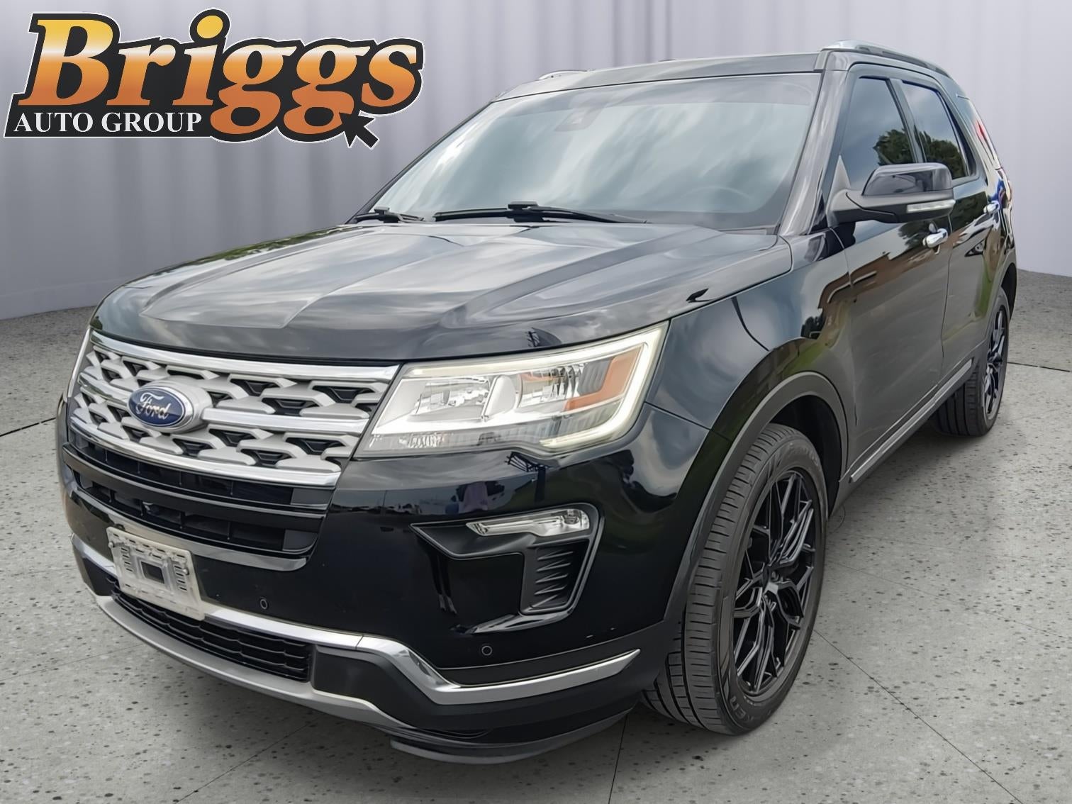 2018 Ford Explorer Limited in Shadow Black — front three-quarter view