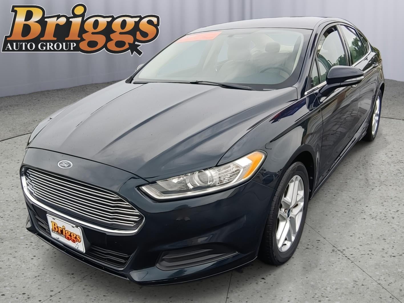 2014 Ford Fusion SE in Dark Side Metallic — front three-quarter view