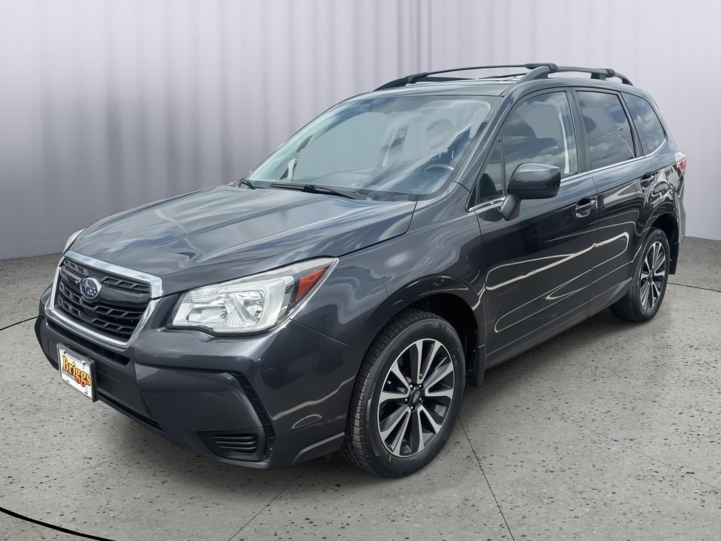 2018 Subaru Forester Premium in Dark Gray Metallic — front three-quarter view